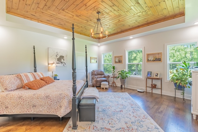 bedroom with multiple windows, a tray ceiling, wood ceiling, and dark hardwood / wood-style flooring