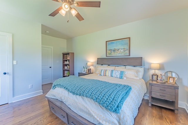 bedroom featuring ceiling fan and hardwood / wood-style flooring