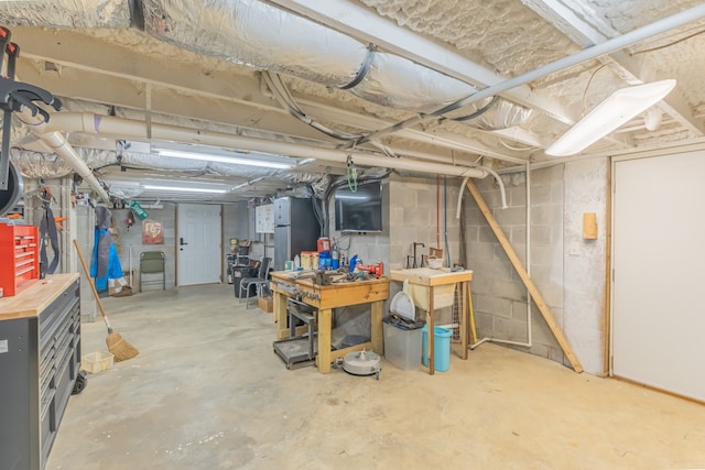 basement with a workshop area