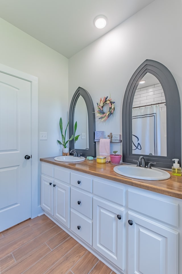 bathroom featuring hardwood / wood-style floors and vanity