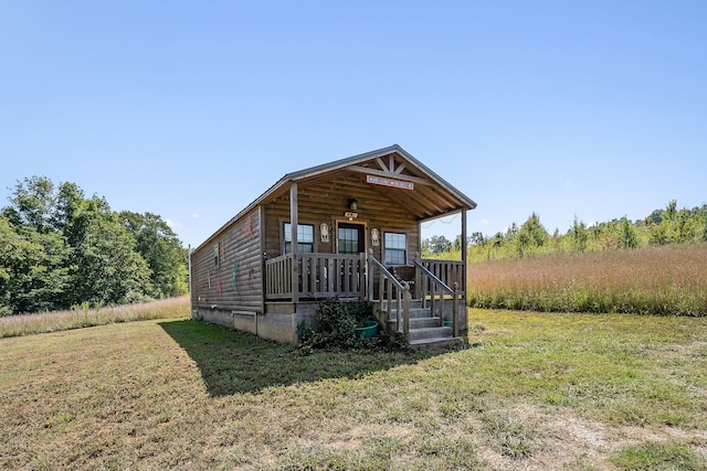 exterior space with a yard and covered porch