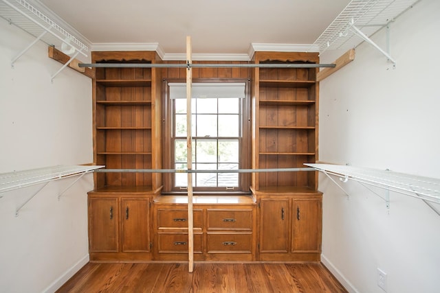 walk in closet featuring light hardwood / wood-style floors