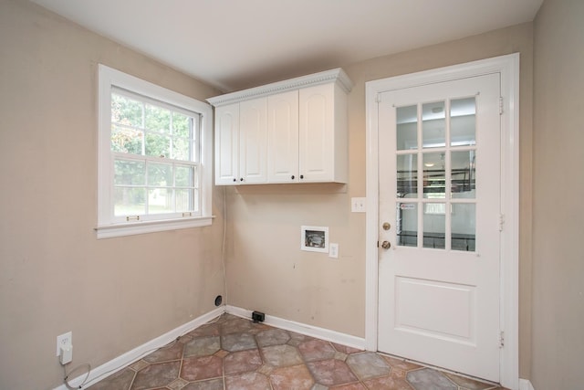 laundry room with hookup for a washing machine, electric dryer hookup, and cabinets