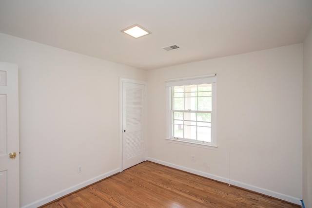 empty room featuring wood-type flooring