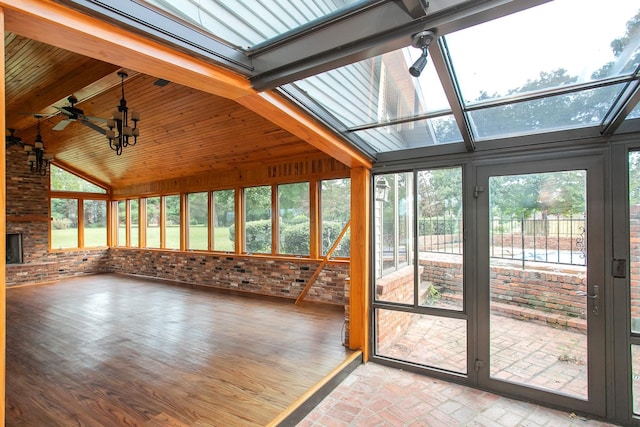 unfurnished sunroom with vaulted ceiling with beams and wooden ceiling