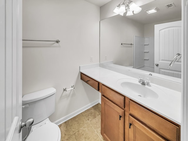 bathroom featuring vanity, toilet, and tile patterned floors