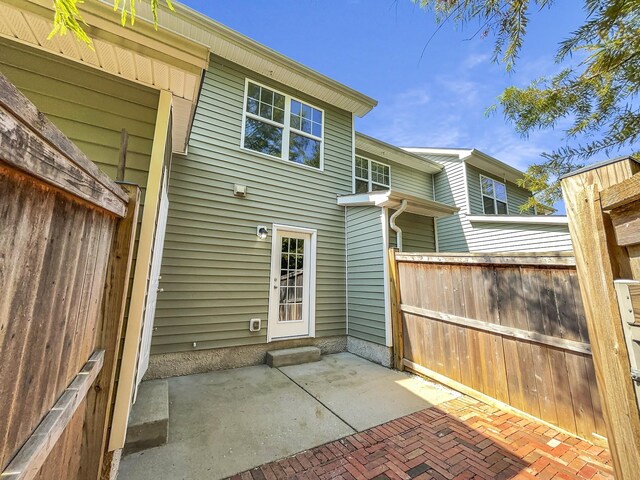 rear view of property featuring a patio