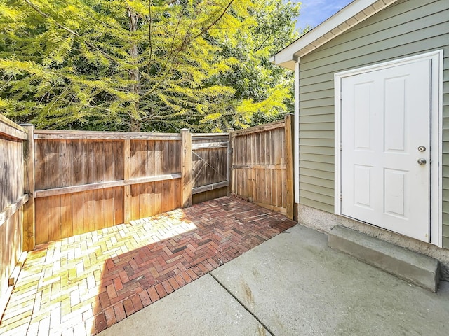 view of patio with entry steps and fence