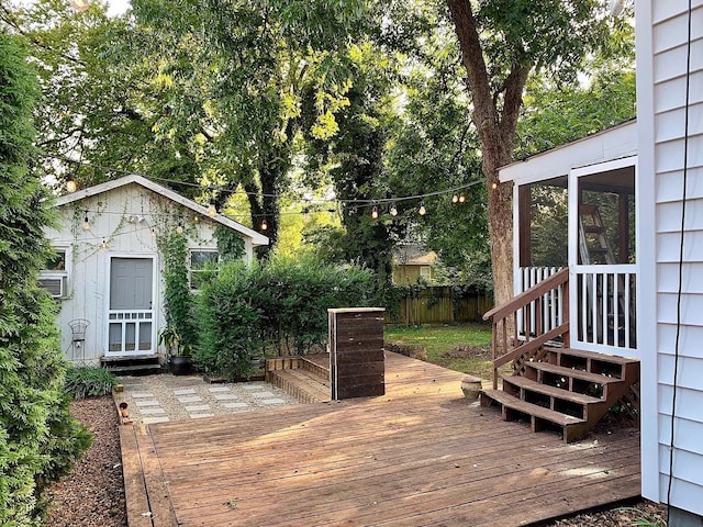 wooden terrace featuring fence