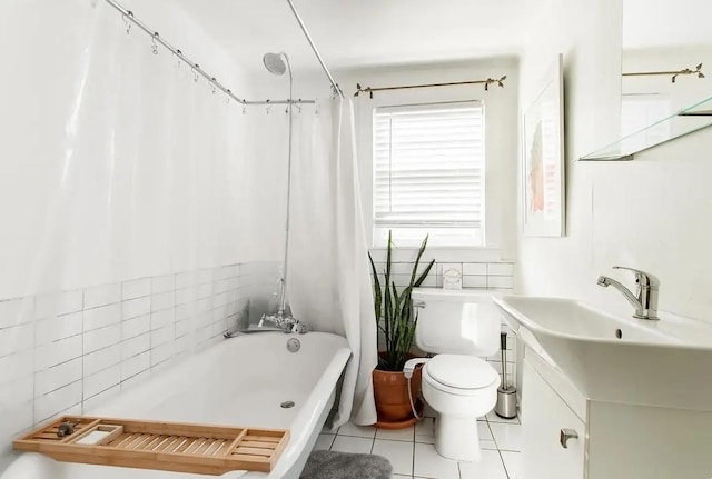 full bathroom featuring vanity, tile patterned flooring, toilet, and shower / tub combo with curtain