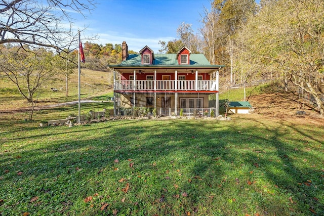89 Ouchonder Rd, Elmwood, TN 38560 - back of house featuring a yard, a sunroom, and a chimney