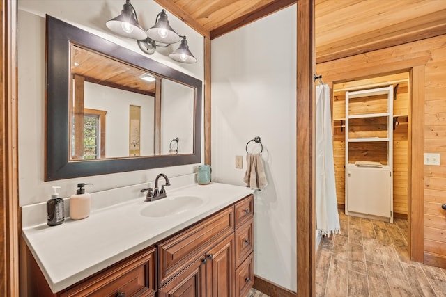 bathroom featuring vanity, wood ceiling, wooden walls, and hardwood / wood-style floors