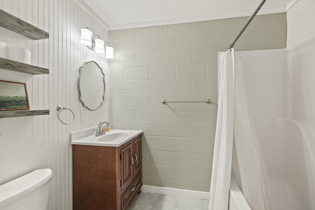 full bathroom featuring toilet, wood walls, shower / bath combo, vanity, and tile patterned floors