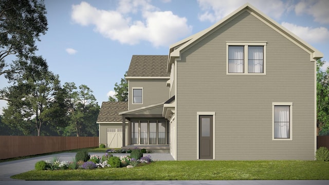 214 38th Ave N, Nashville, TN 37209 - back of property with roof with shingles, fence, and a lawn
