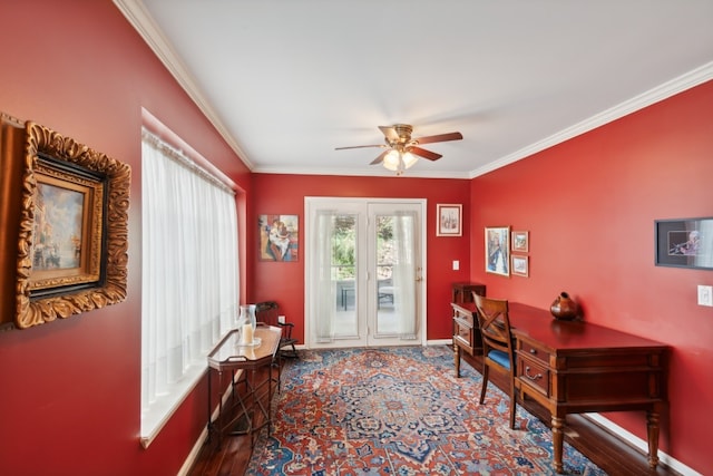 office space with ornamental molding, dark wood-type flooring, and ceiling fan