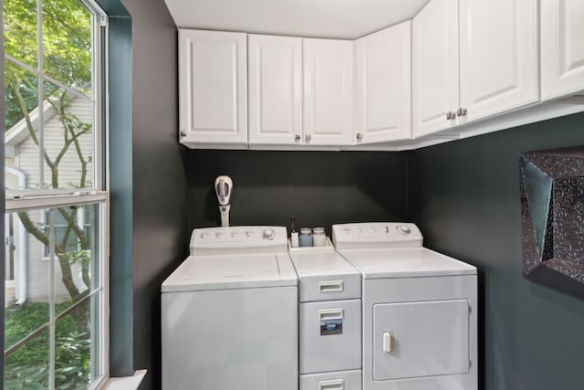 laundry area featuring cabinets and washer and dryer