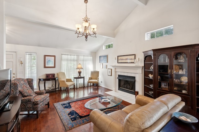 living room featuring a tiled fireplace, a chandelier, beamed ceiling, dark wood-type flooring, and high vaulted ceiling