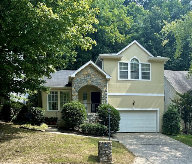 view of front facade featuring a front lawn and a garage