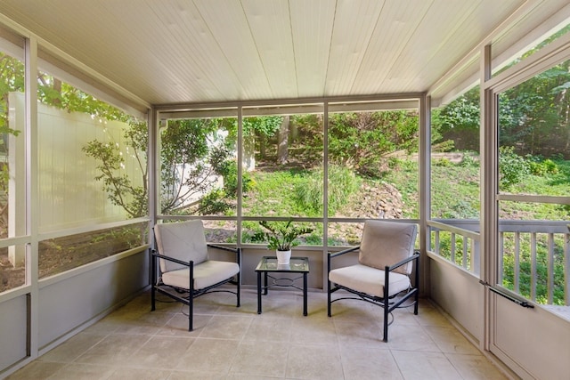 sunroom / solarium featuring wooden ceiling