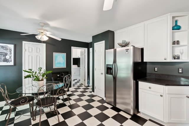 kitchen with washer / clothes dryer, ceiling fan, white cabinets, and stainless steel refrigerator with ice dispenser