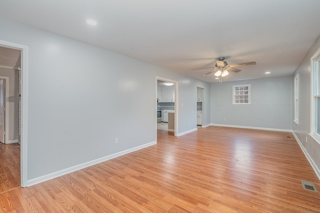 unfurnished living room with light hardwood / wood-style floors and ceiling fan