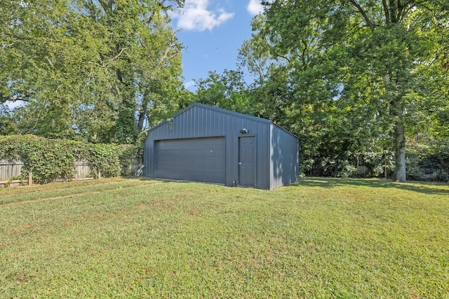 view of outdoor structure featuring fence and an outdoor structure