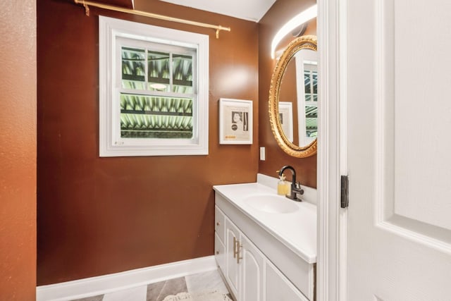 bathroom with baseboards and vanity