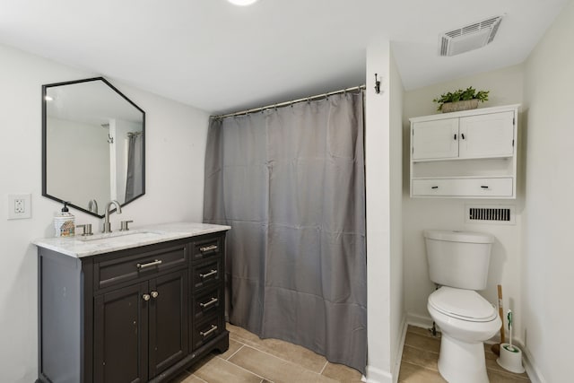 bathroom with tile patterned floors, toilet, curtained shower, and vanity