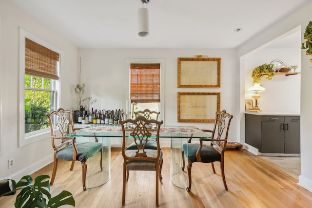 dining room with light wood-type flooring