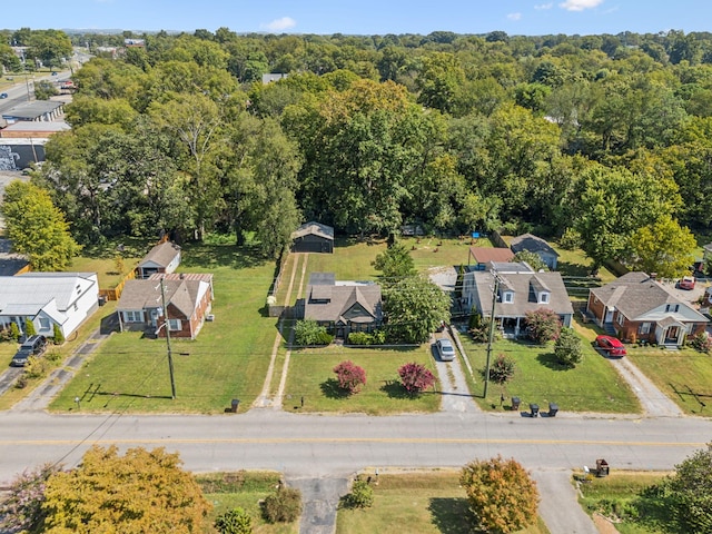 aerial view with a residential view and a view of trees