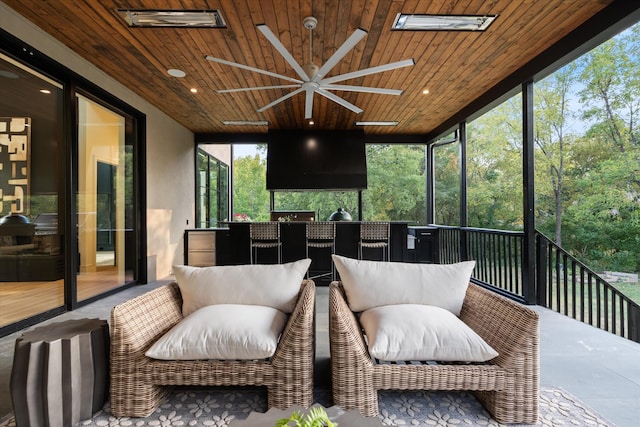 sunroom with wood ceiling and visible vents