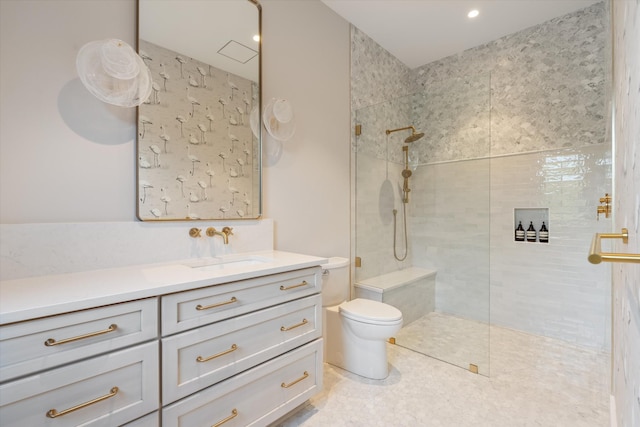 full bath with tiled shower, tile patterned flooring, vanity, and toilet