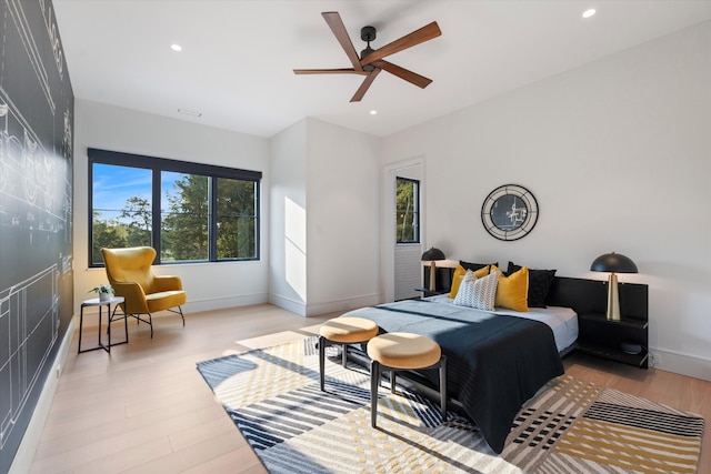 bedroom with recessed lighting, ceiling fan, light wood-style flooring, and baseboards