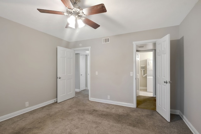 unfurnished bedroom featuring carpet and ceiling fan