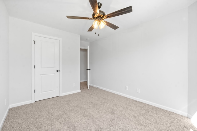 unfurnished bedroom with ceiling fan and carpet floors