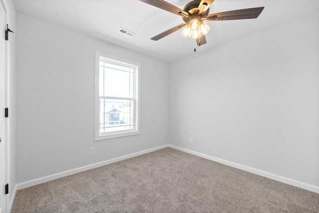 unfurnished room featuring ceiling fan and carpet flooring