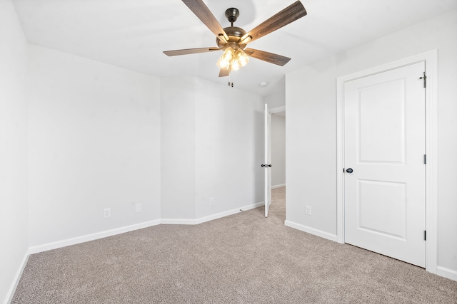 unfurnished bedroom featuring light carpet and ceiling fan