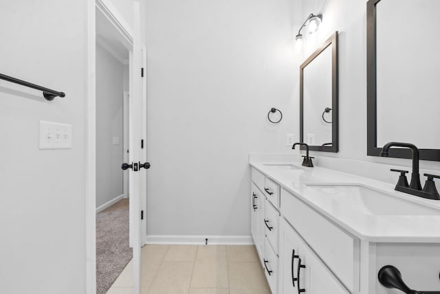 bathroom with tile patterned floors and vanity