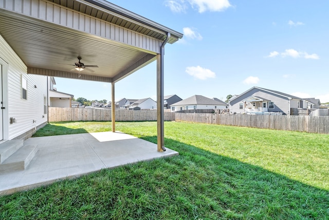 view of yard featuring ceiling fan and a patio area