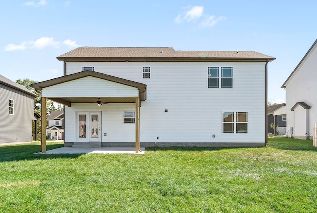 back of property featuring ceiling fan, a patio, french doors, and a lawn