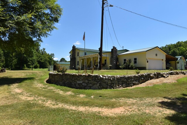 view of front facade with a garage and a front lawn