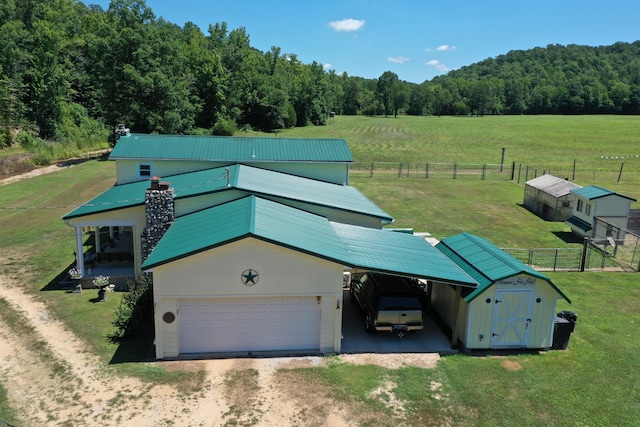 birds eye view of property featuring a rural view