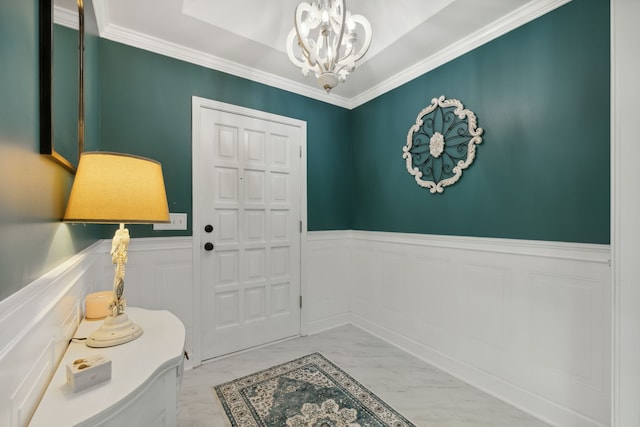 interior space with ornamental molding and an inviting chandelier