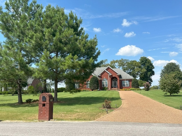 ranch-style home with a front yard