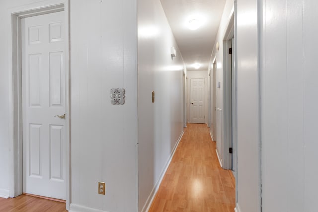 hall with light hardwood / wood-style flooring