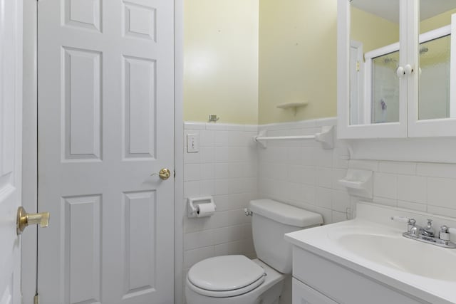 bathroom featuring an enclosed shower, toilet, tile walls, decorative backsplash, and vanity