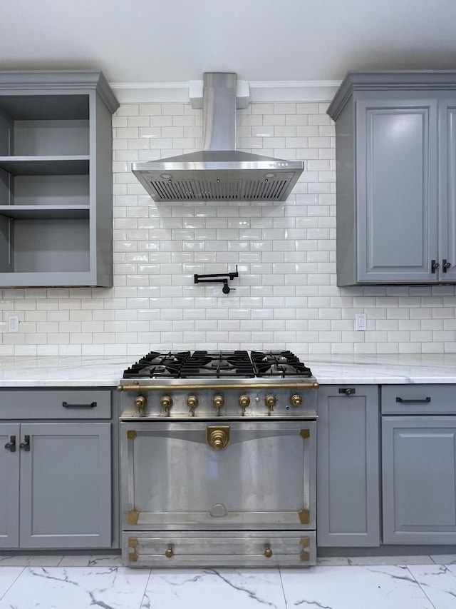401 College St, Petersburg, TN 37144 - kitchen featuring marble finish floor, wall chimney exhaust hood, gray cabinets, and gas stove