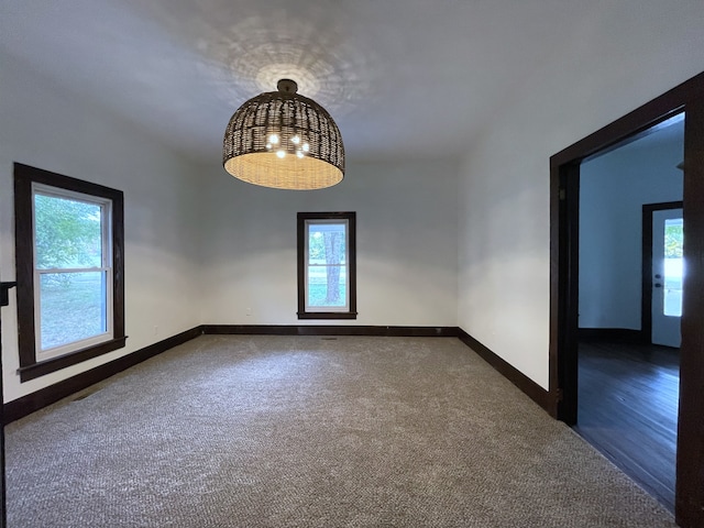 unfurnished room featuring dark hardwood / wood-style floors