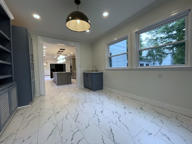 interior space with crown molding and sink