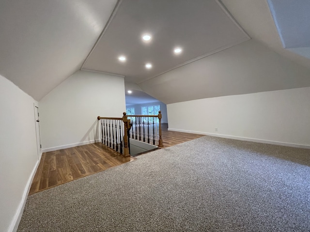 bonus room featuring lofted ceiling and wood-type flooring